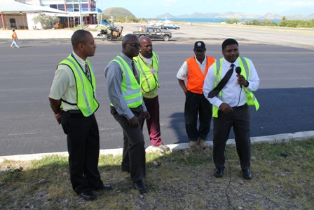 (L-R) Manager of the Vance W. International Airport Stephen Hanley, Permanent Secretary in the Ministry of Communication and Works Ernie Stapleton, Supervisors at the Public Works Department Danny Williams and Antonio Marshall and Junior Minister responsible for Communications and Works Hon. Troy Liburd at the Vance W. Amory International Airport on January 28, 2014